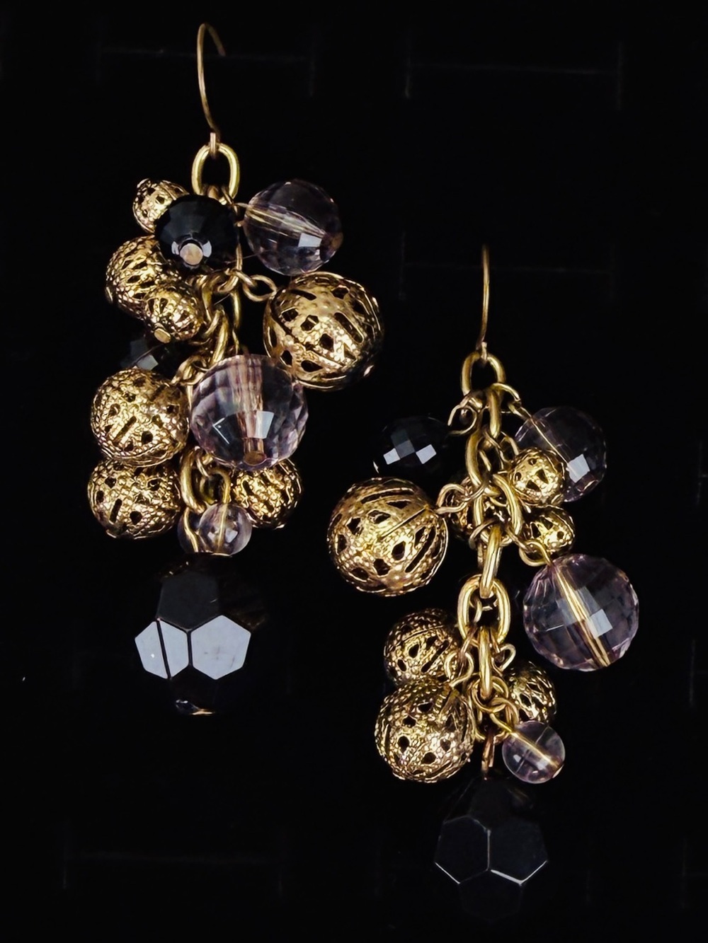 Beautiful aged goldtone, clear and black charm cha-cha pierced dangle earrings